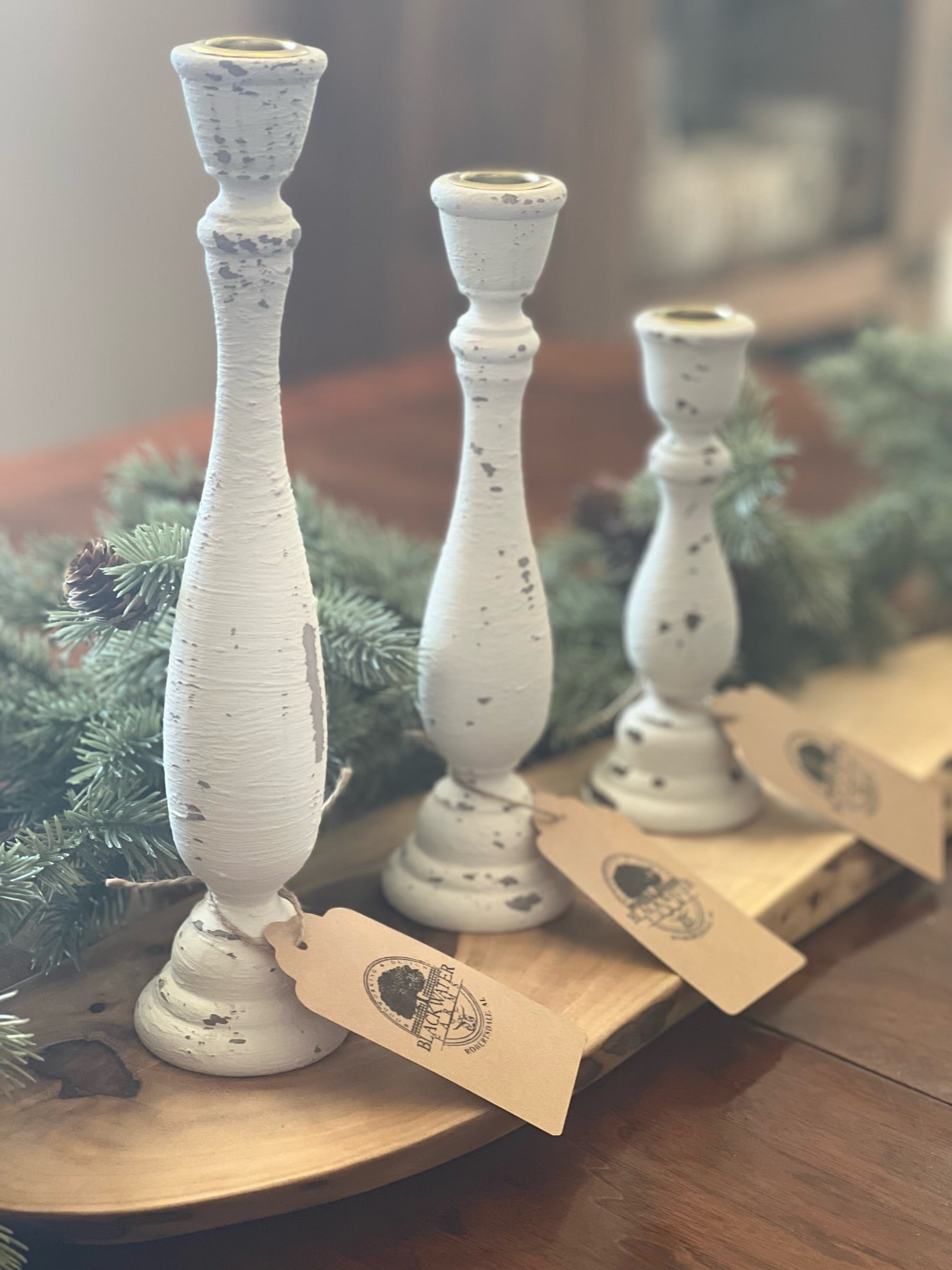 Set of 3 rustic wood candlesticks – farmhouse home décor, 7", 9-1/4", 11-1/4"

Handcrafted wooden candlesticks in rustic farmhouse style for table centerpiece

Rustic wood candlesticks displayed on mantel – set of 3 varying heights

Farmhouse décor wooden candle holders – small, medium, large candlesticks

Handcrafted rustic candlestick set – wooden home accents for shelves or tables

Vintage style wooden candlesticks – rustic farmhouse home décor set of 3

Solid wood candlesticks with layered heights – per