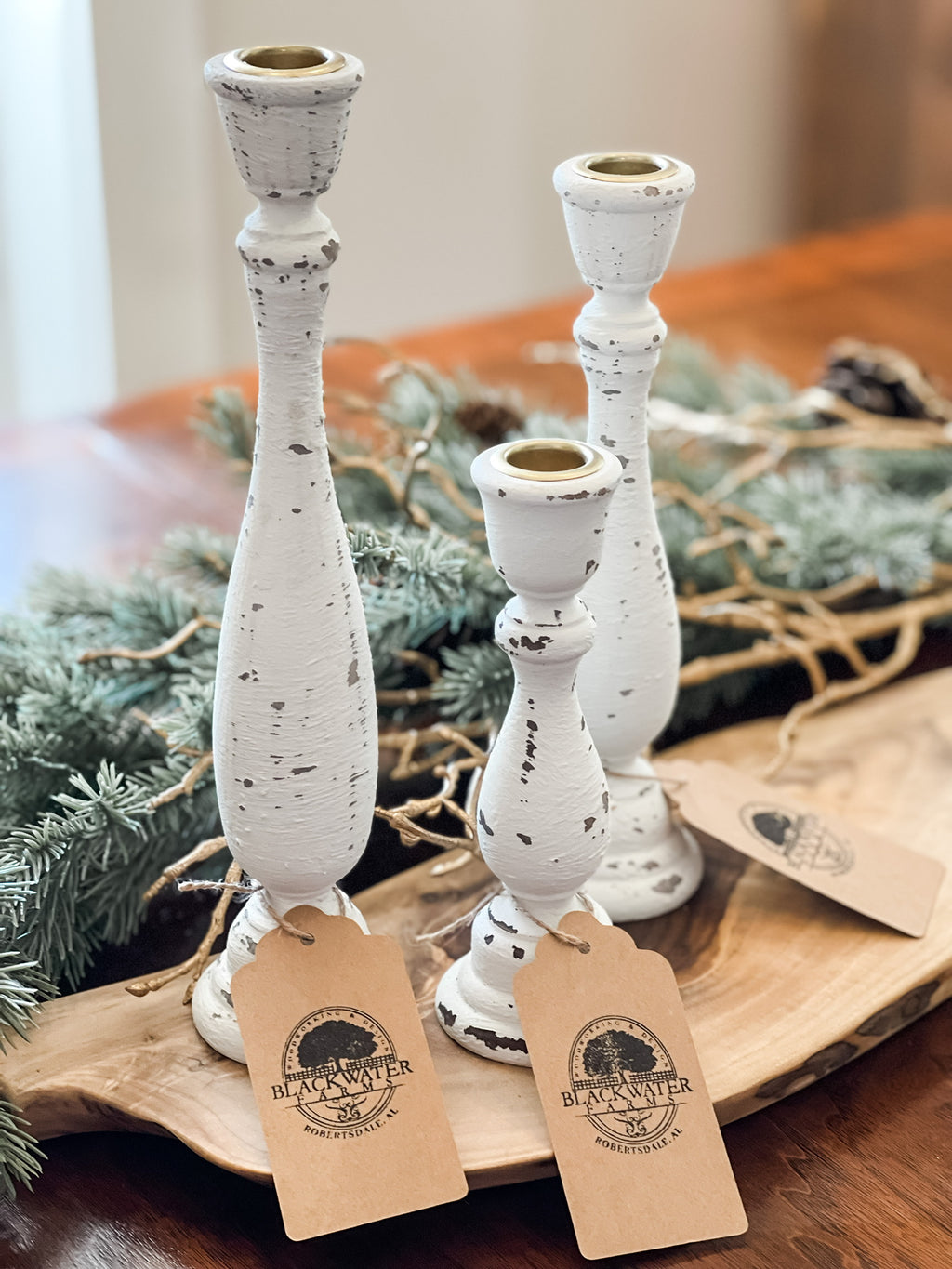 Set of 3 rustic wood candlesticks – farmhouse home décor, 7", 9-1/4", 11-1/4"

Handcrafted wooden candlesticks in rustic farmhouse style for table centerpiece

Rustic wood candlesticks displayed on mantel – set of 3 varying heights

Farmhouse décor wooden candle holders – small, medium, large candlesticks

Handcrafted rustic candlestick set – wooden home accents for shelves or tables

Vintage style wooden candlesticks – rustic farmhouse home décor set of 3

Solid wood candlesticks with layered heights – per