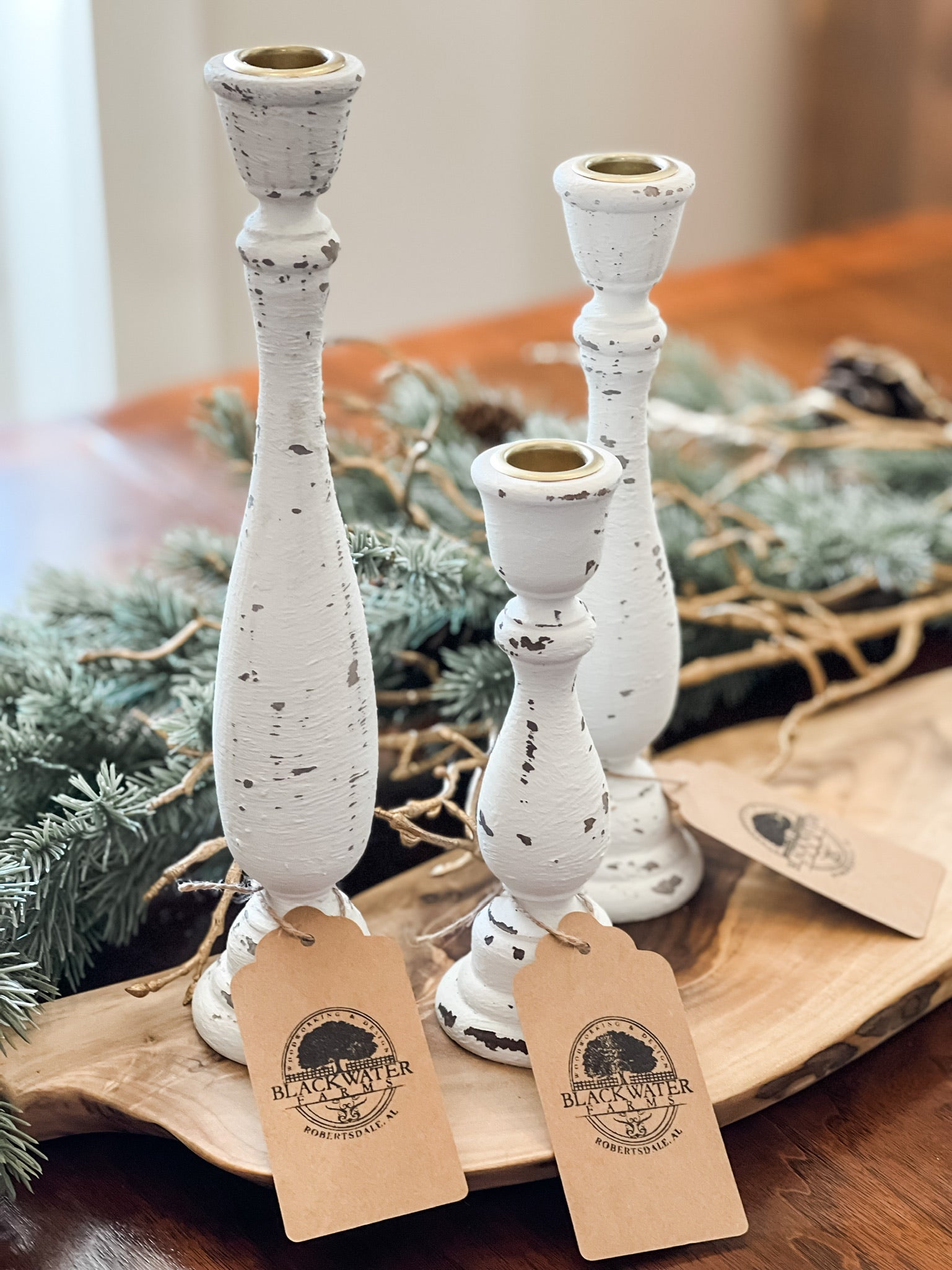 Set of 3 rustic wood candlesticks – farmhouse home décor, 7", 9-1/4", 11-1/4"

Handcrafted wooden candlesticks in rustic farmhouse style for table centerpiece

Rustic wood candlesticks displayed on mantel – set of 3 varying heights

Farmhouse décor wooden candle holders – small, medium, large candlesticks

Handcrafted rustic candlestick set – wooden home accents for shelves or tables

Vintage style wooden candlesticks – rustic farmhouse home décor set of 3

Solid wood candlesticks with layered heights – per