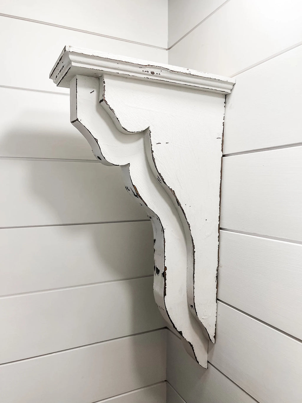 Pair of white distressed wood corbels with sleek minimalist line design